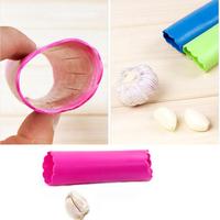 Éplucheur d'ail en tube de silicone à bas prix de l'usine de Shenzhen, éplucheur de peau d'ail pour l'épluchage de l'ail