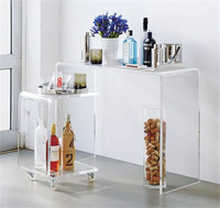 Table basse en acrylique transparente de luxe moderne sur mesure pour salon, avec roulettes, en carton, pour grossistes