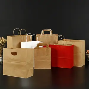 En gros luxe personnaliser logo imprimé artisanal recyclable sac à provisions en papier cadeau sacs logo personnalisé avec poignées