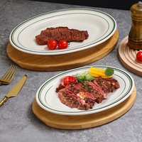 Assiettes ovales en porcelaine blanche de qualité commerciale 10/12 pouces pour la restauration et les mariages