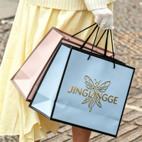 Sac cadeau en papier découpé sur mesure avec poignée et impression de logo pour le shopping et l'emballage cadeau de marques privées