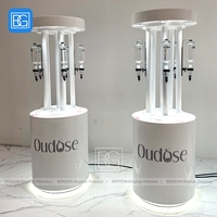 Support d'affichage de vente au détail cylindrique de luxe avec finition peinte, éclairage LED, présentoir pour flacon de parfum