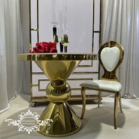 Table de mariage ronde dorée pour gâteau