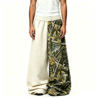 Pantalon de jogging ample pour homme, patchwork vert olive et camouflage feuilles, couleur contrastante, style streetwear, coupe oversize