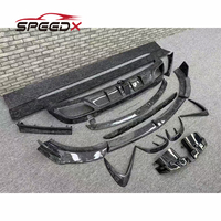 Kit carrosserie carbone Mansory pour Mercedes Benz Classe S W223, comprenant lèvre avant, jupes latérales, diffuseur arrière et spoiler.