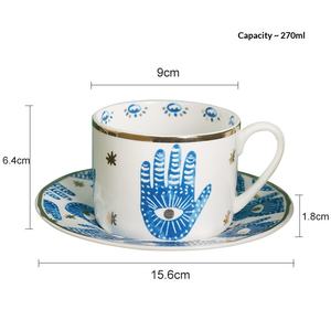 Ensemble de tasses à café en céramique à motif main de Hamsa avec bordure dorée et <span class=keywords><strong>soucoupe</strong></span> assortie pour des pauses-café à <span class=keywords><strong>la</strong></span> maison de style bohème et comme cadeau - Product Image 6