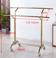 Porte-vêtements pliable télescopique sur pied réglable, support de séchage et de rangement en métal de luxe.