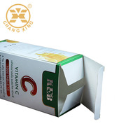 Boîte d'emballage personnalisée pour pilules et médicaments en papier blanc 350 g/m² avec impression décalée et fond à boucle, organisateur de vitamines
