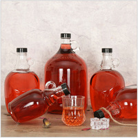 Vente directe d'usine, bouteilles en verre ambré transparentes personnalisées de 1000 ml (32 oz) pour l'emballage en verre