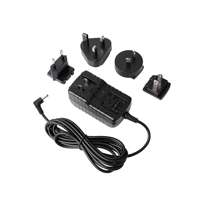 Adaptor steker 12 V 1A yang dapat dipertukarkan 12 Volt 1 Amp US EU AU steker dinding Adaptor pengisi daya untuk LED CCTV Monitor
