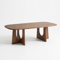 Table basse ovale moderne en bois massif avec base en U sculpturale, mobilier durable et écologique pour salon, bureau, chambre et salle à manger