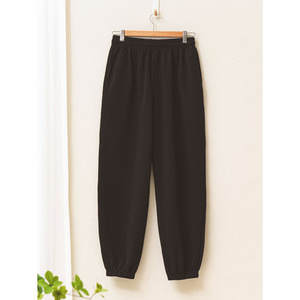 L Pantalones de gimnasia negros de entrenamiento de humedad - Product Image 1