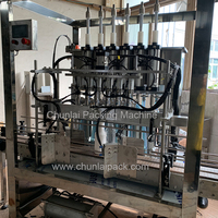 Machine de remplissage automatique par gravité PLC à 4 buses pour bouteilles en verre, boissons, produits chimiques, huile, poudre, fûts et emballages métalliques – Garantie 1 an