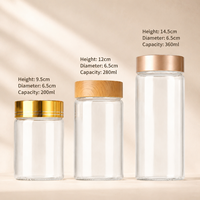 Bouteilles en verre transparent en gros avec couvercles en bois noir et or, logo personnalisé pour le stockage d'aliments, de bonbons, de grains de café, de capsules
