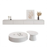 Table basse ronde de salon au design artistique de luxe, ensemble table basse et meuble TV en bois simple pour appartement moderne