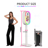 Photomaton ovale pour iPad, très demandé, en métal épaissi avec revêtement par pulvérisation haute température et éclairage RGB contrôlé par application, portable.