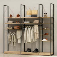 Mobilier de magasin de vêtements pour hommes personnalisé présentoir modulaire en métal pour vêtements, costumes, chemises, système d'étagères réglables