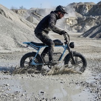 Vélo électrique tout-terrain robuste pour adultes avec suspension, pneus larges, idéal pour la pratique hors route sur les chemins de gravier