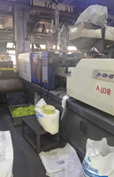 Machine de moulage par injection plastique ZHENHUA 128T pour la fabrication de plantes artificielles décoratives de jardin en plastique à deux couleurs