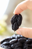 Raisins noirs séchés naturels, gros fruits, vente en gros