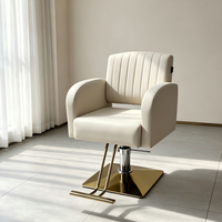 Fauteuil de coiffure hydraulique Ivoire avec base dorée et dossier cannelé – Mobilier de salon de coiffure en gros