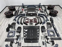 Kit carrosserie aérodynamique complet en fibre de carbone pour Mercedes G63 W464 SUV tout-terrain, comprenant des ailes larges, un capot BRABUS et un diffuseur arrière.