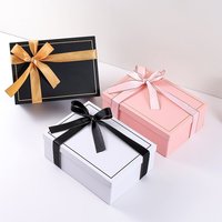 Boîte en carton de luxe haut de gamme personnalisée avec logo magnétique en forme de livre pour emballage cadeau avec ruban et doublure en éponge pour nettoyant visage