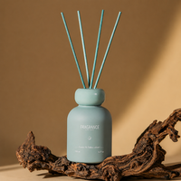 Diffuseur de parfum d'ambiance en céramique mate, bouteille ronde 150 ml, avec bâtonnets bleus et bouchon large, pour parfumer la pièce