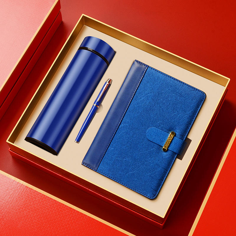 Blue thermos flask, pen and notebook