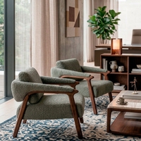 Fauteuil d'appoint moderne et durable en tissu rembourré avec structure en bois et design capitonné pour hôtels, appartements, villas et salons