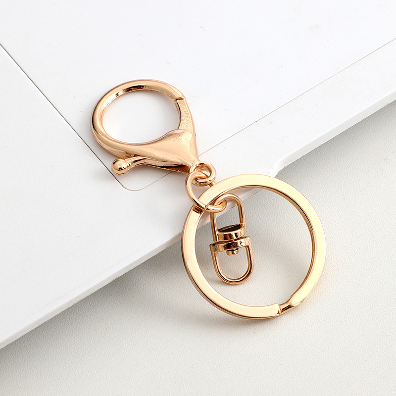 Ensemble de trois fermoirs mousquetons, modèle "8", plaqué or KC