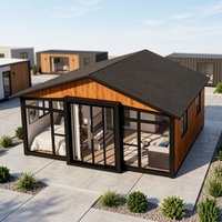 Nouvelle conception moderne de maison conteneur extensible à toit incliné de 20 pieds et 40 pieds avec balcon et toit pour villa et immeuble de bureaux