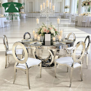 Mesa Redonda Grande con Base de Acero Inoxidable Plateado y Tapa de Cristal para Bodas - Product Image 1