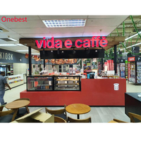 Comptoir de bar rétroéclairé avec logo en forme de U en pierre de quartz Corian rouge de Chine pour kiosque de fruits