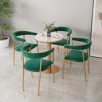 Hôtel nordique moderne luxe métal PU cuir rembourré chaise de salle à manger de luxe Table en marbre ensemble groupe pour 4 personnes