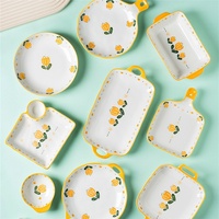 Service de table en céramique japonaise avec motifs de tulipes au style frais, comprenant des bols à riz et des assiettes plates, passe au lave-vaisselle.