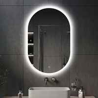 Miroir de salle de bain mural ovale blanc moderne tendance 2025 avec éclairage LED, anti-buée, capteur tactile, Bluetooth et indice de protection IP44