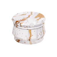 Vente en gros de broyeur d'herbes sèches à 4 couches Accessoires pour fumeurs personnalisés Broyeur manuel en métal de 63mm avec logo personnalisé OEM