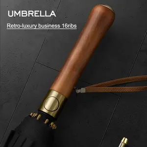 Kaan Custom printed business wood and copper handle 25 inches big size black coating luxury strong high quality umbrella