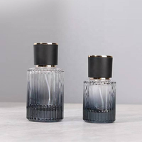 Flacon de parfum en verre à rayures verticales noir de luxe 50 ml avec bouchon rond et atomiseur, conteneur vide pour cosmétiques