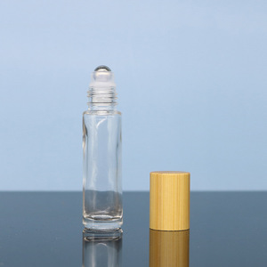 Envases LK al por mayor: Botellas cilíndricas de vidrio de 10 ml, color ámbar esmerilado, transparentes o negras, con estampado en caliente, para perfume y aceites esenciales, con rodillo y tapa de madera. - Product Image 2