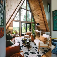 Cabane préfabriquée contemporaine en acier léger en forme de A avec système modulaire pour villas écologiques, chambres d'hôtes et retraites de vacances