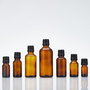 Vente en gros rechargeable 15ml 50ml 100ml bouteille cylindrique en verre de Boston bouteille en verre d'huile essentielle cosmétique ambre avec couvercle à vis - Product Image 1