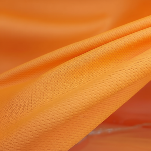 Tissu à tricoter à œillets blanc et orange à séchage rapide % 100 polyester organique pour uniformes de football vêtements de voiture et de sport - Product Image 1
