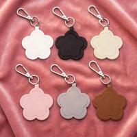 Miroir de maquillage miniature en cuir PU tendance, miroir en forme de fleur adorable, accessoire de sac à main multifonctionnel, pendentif pour femmes
