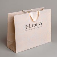 Sacs cadeaux en papier biodégradables imperméables de luxe personnalisés avec estampage d'aluminium Emballage de bijoux et de bougies avec logo personnalisé
