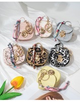 Mini porte-clés transfrontalier de haute qualité, écologique, en cuir PU, forme ovale, avec motif léopard mignon, porte-monnaie et étui pour écouteurs