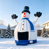 Château gonflable dôme robuste avec thème bonhomme de neige en chapeau noir pour la location d'événements de Noël, de festivals et de carnavals