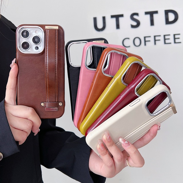 Elegant Oil Wax Skin Leather Metal Camera Ring Phone Case with Hand Strap for iPhone 16 15 14 13 Pro Max TPU+Leather Case