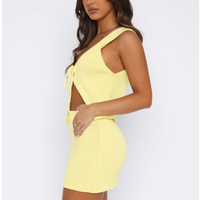 Ensemble 2 pièces personnalisé pour femme : Crop top sans manches à nouer devant et mini-jupe moulante, idéal pour les soirées d'été et les clubs